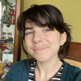 MADDIE WOLF (THEY/SHE)